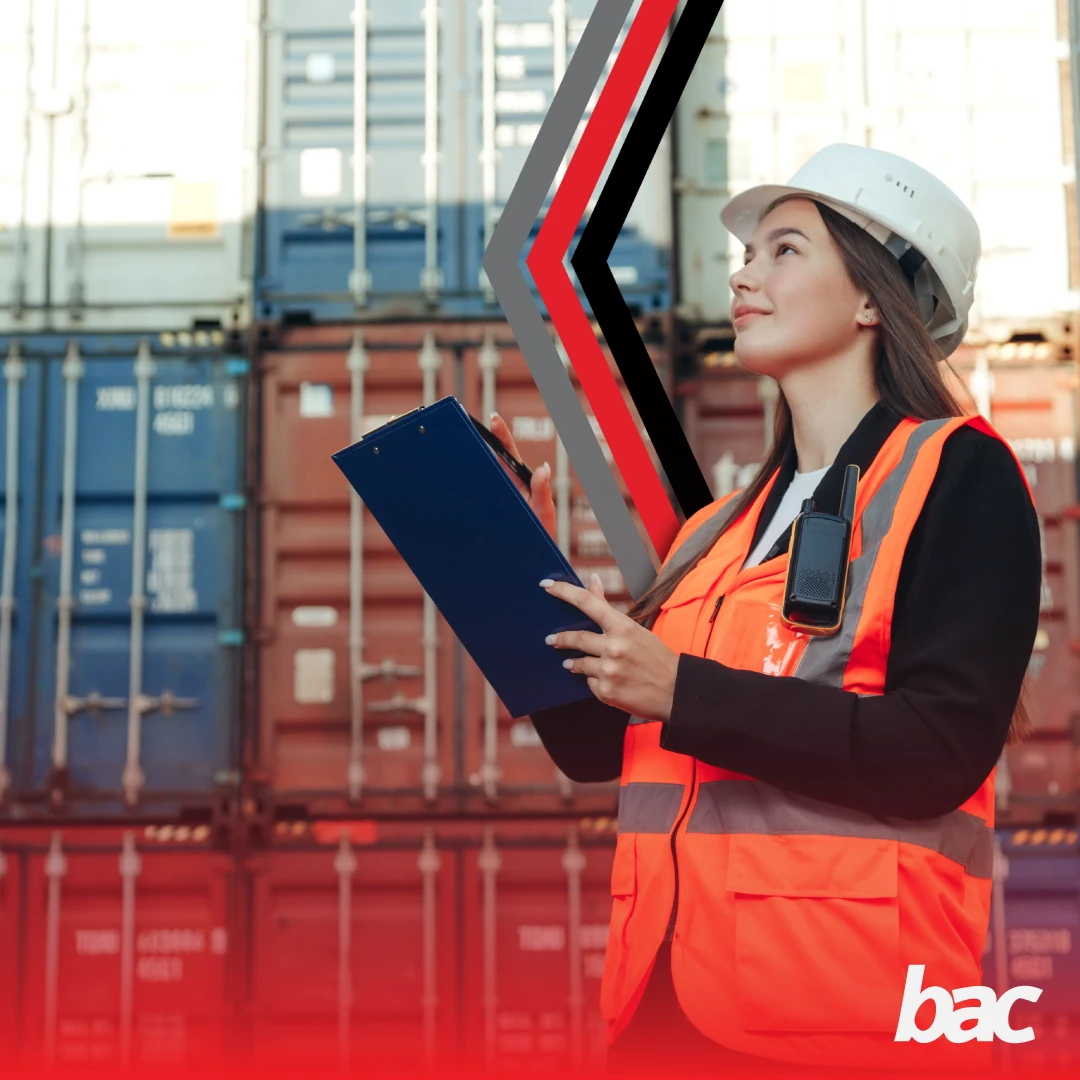 Customs and logistics specialist with clipboard at a shipping container yard (BAC)