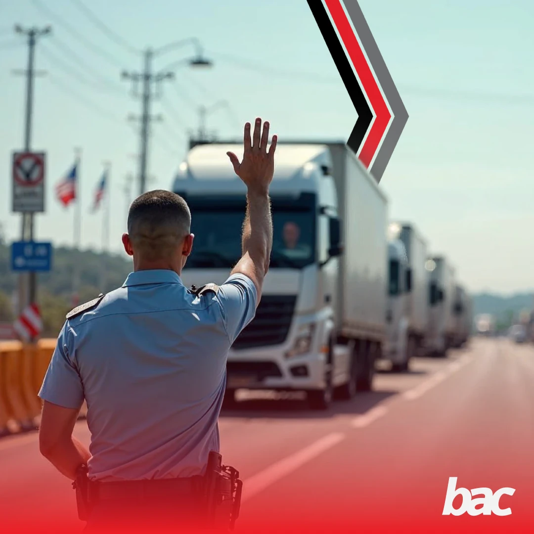 Border control officer directing trucks at a Southern African crossing, representing cross-border freight inspection and logistics coordination