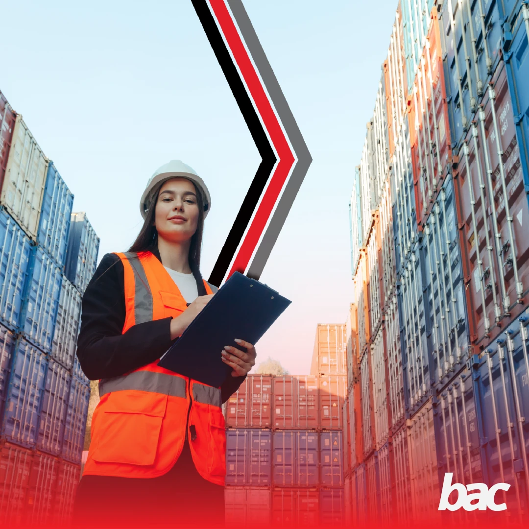 Logistics worker with clipboard standing in a container yard