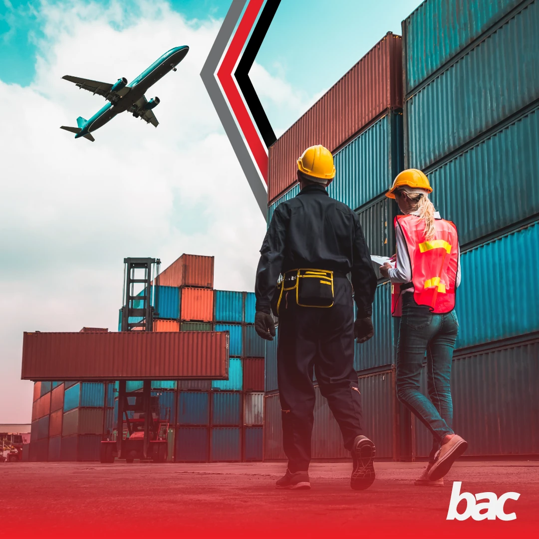 Logistics workers inspecting freight containers near air cargo operations