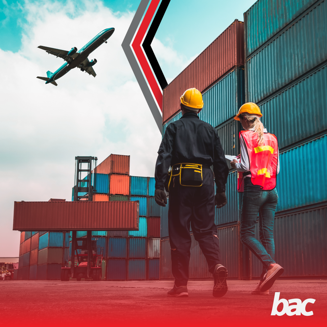 Logistics workers inspecting freight containers near air cargo operations